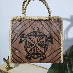 Unique hand crafted leather + woven grass handba